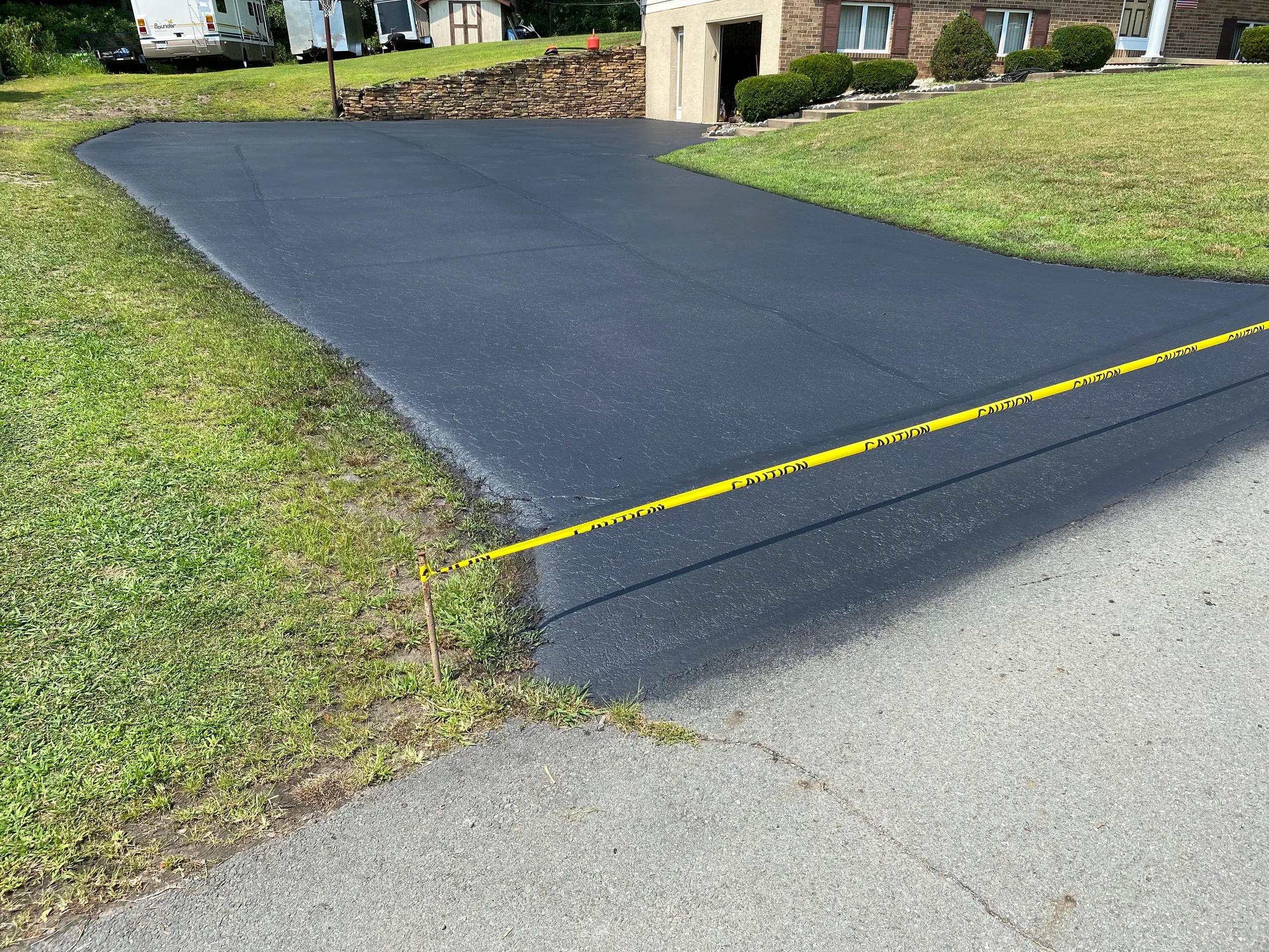 Wide commercial property driveway freshly sealed