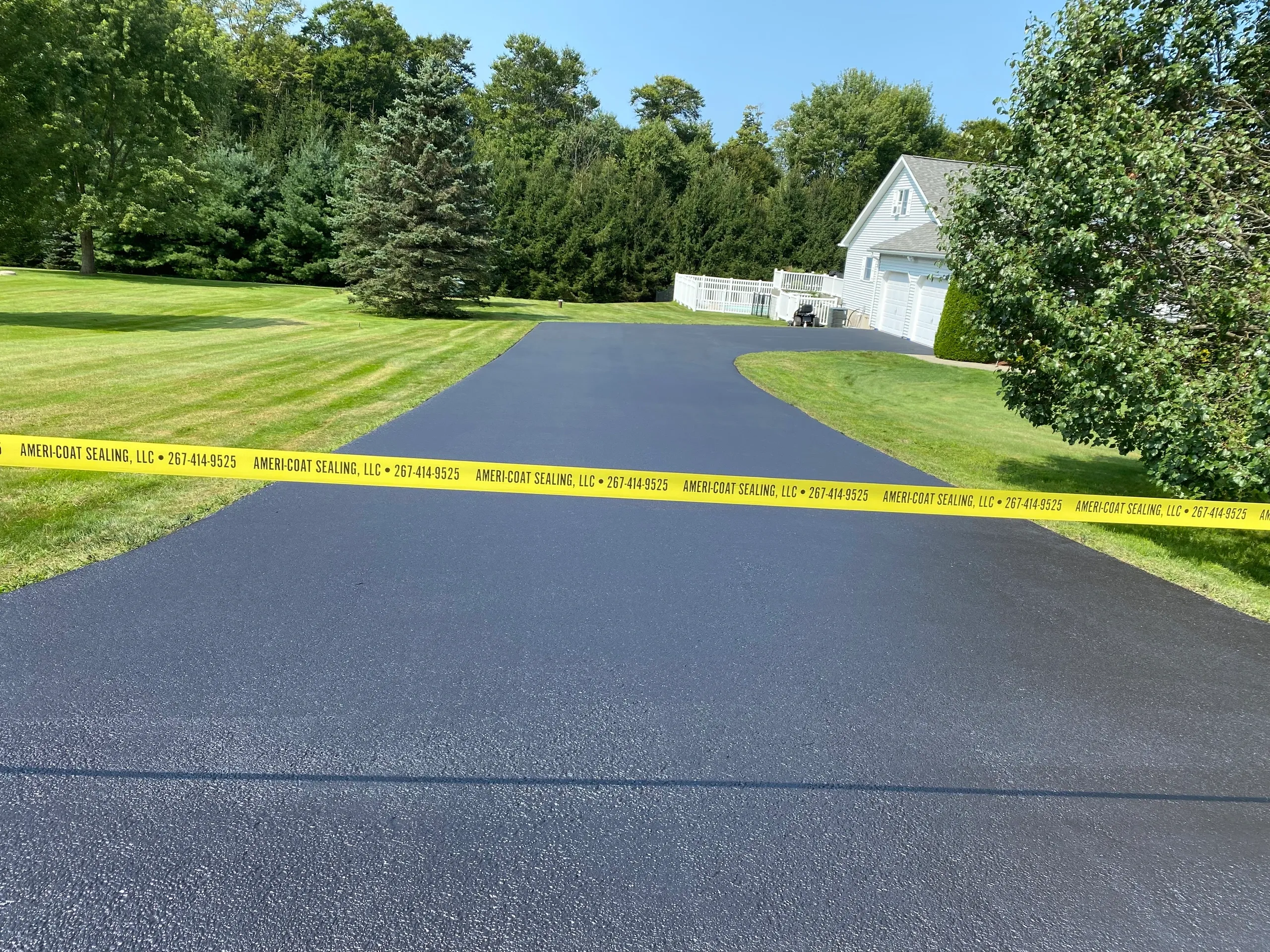 Winding estate driveway after professional sealcoating