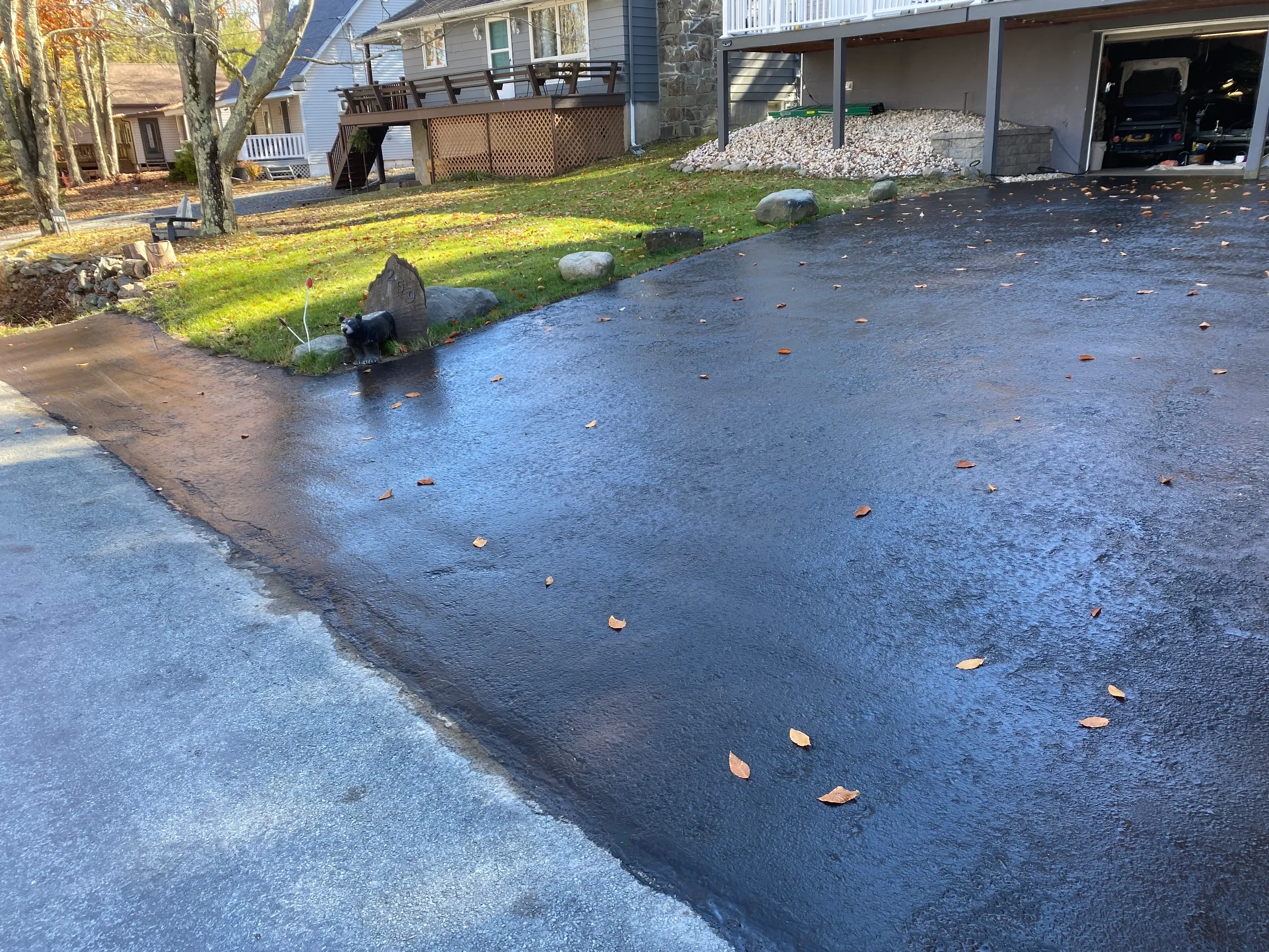 Residential driveway sealcoated in autumn